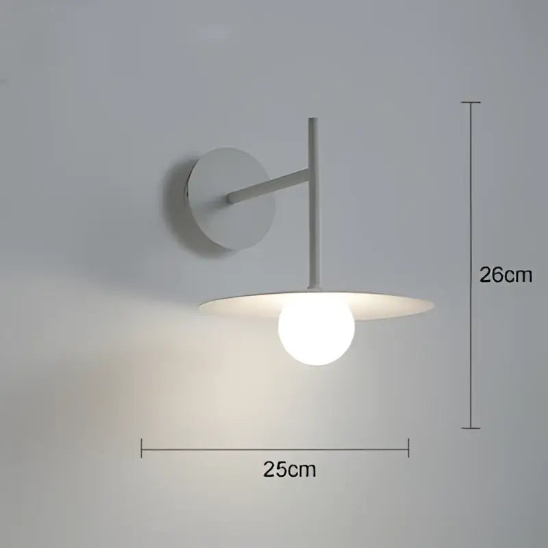 Minimalist white wall lamp with a circular base and frosted glass shade in decorbites industrial style wall design