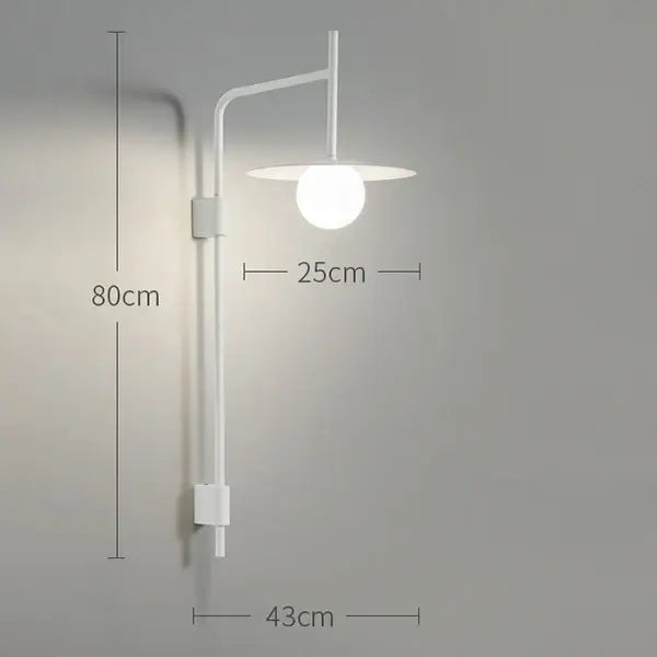 Minimalist white wall lamp with sleek curved arm and frosted glass globe shade in decorbites industrial style wall design