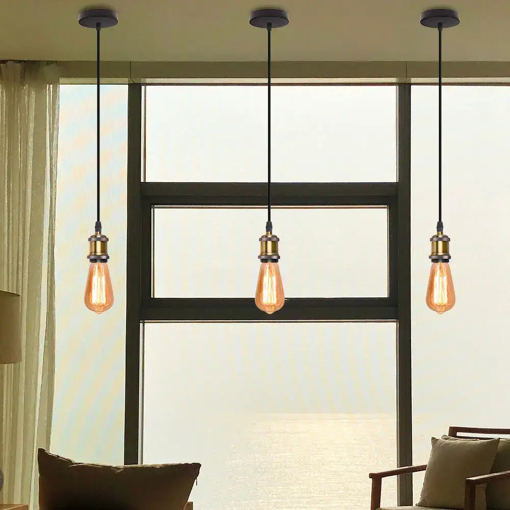 Three vintage-style decorbites iron pendant lights with amber glass and brass finish for dining room decor