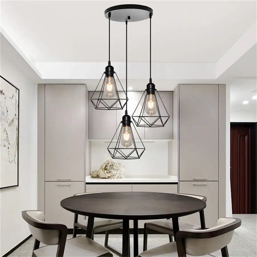 Industrial black pendant light with diamond cage wrought iron and exposed filament bulbs for kitchen use