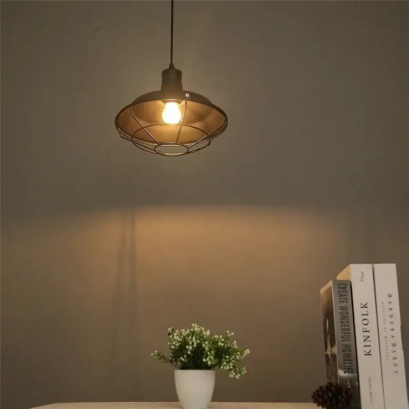 Industrial black and white iron pendant lights with metal cage design and warm glow for kitchen decorbites iron pendant