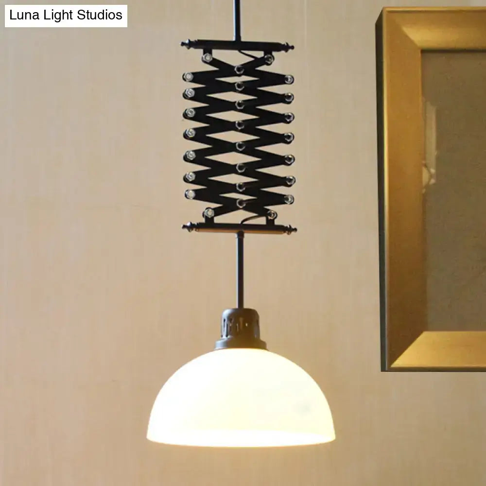 Black metal scissor-style pendant light with frosted glass dome shade in black white finish for balcony lighting