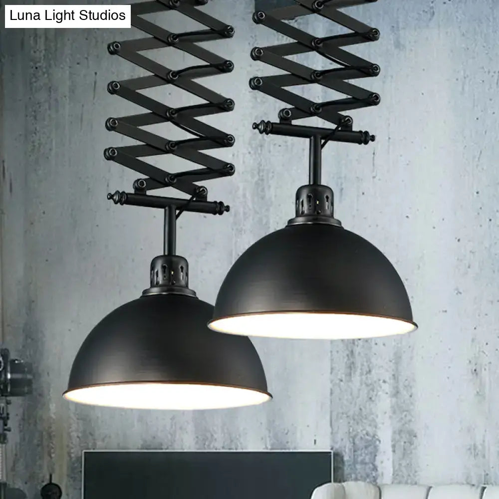 Black industrial-style pendant light with extendable accordion arms and matte dome shade in black white finish