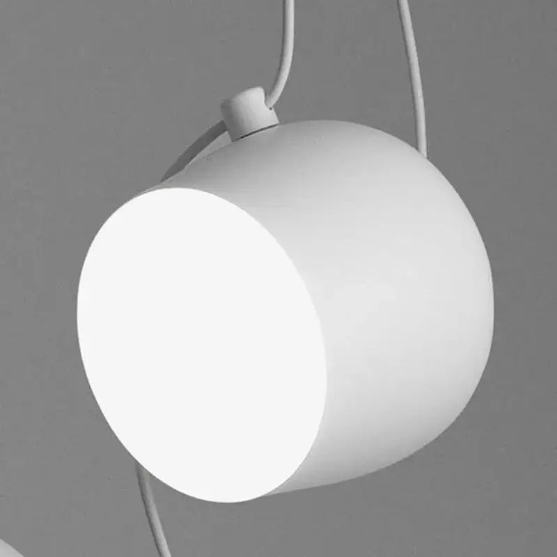 White cylindrical pendant light with matte finish and minimalist design for decorbites industrial black white dining room decor