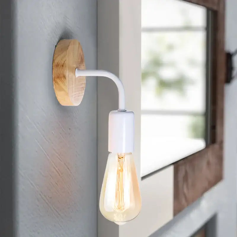 A rustic wall lamp with natural wood base, white curved metal arm, and exposed filament bulb featuring decorbites hemp rope wall design