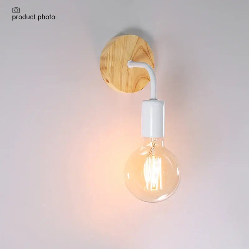 A warm-toned industrial black and wood hemp rope wall lamp with edison bulb and natural wood wall plate decorbites hemp rope