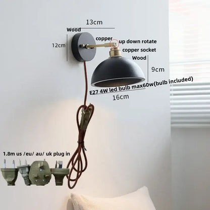 Industrial black wood led wall sconce with a black dome shade wooden base and copper accents by decorbites