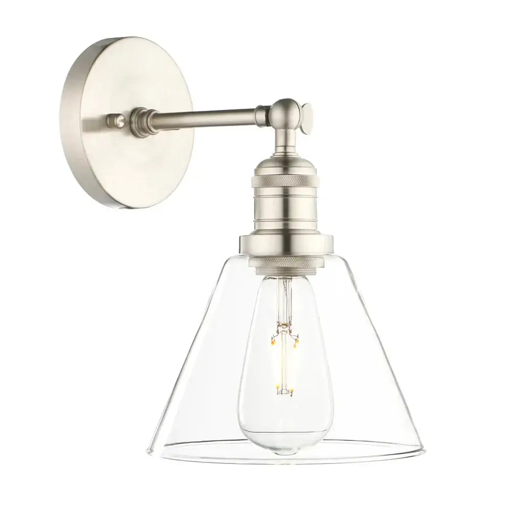 Brushed nickel wall lamp with clear glass conical shade and exposed Edison bulb for industrial bedroom lighting