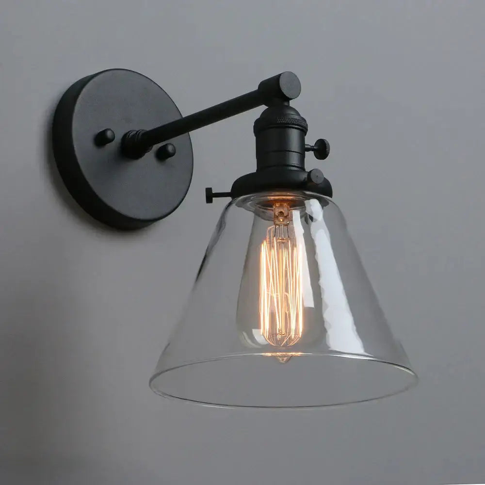 Industrial black wrought iron wall sconce with clear glass bell shade and exposed Edison bulb for kitchen decorbites cone canopy wall