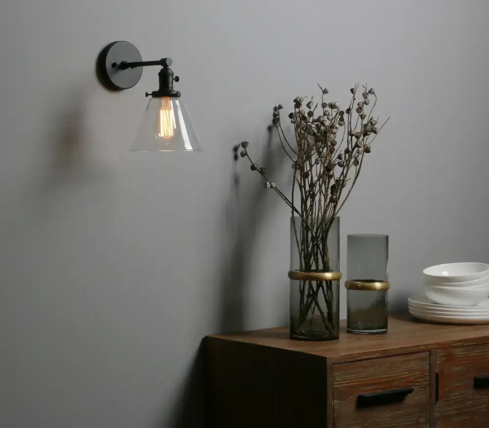 Industrial black wrought iron wall sconce with cone canopy glass shade and exposed filament bulb for kitchen decorbites cone canopy wall