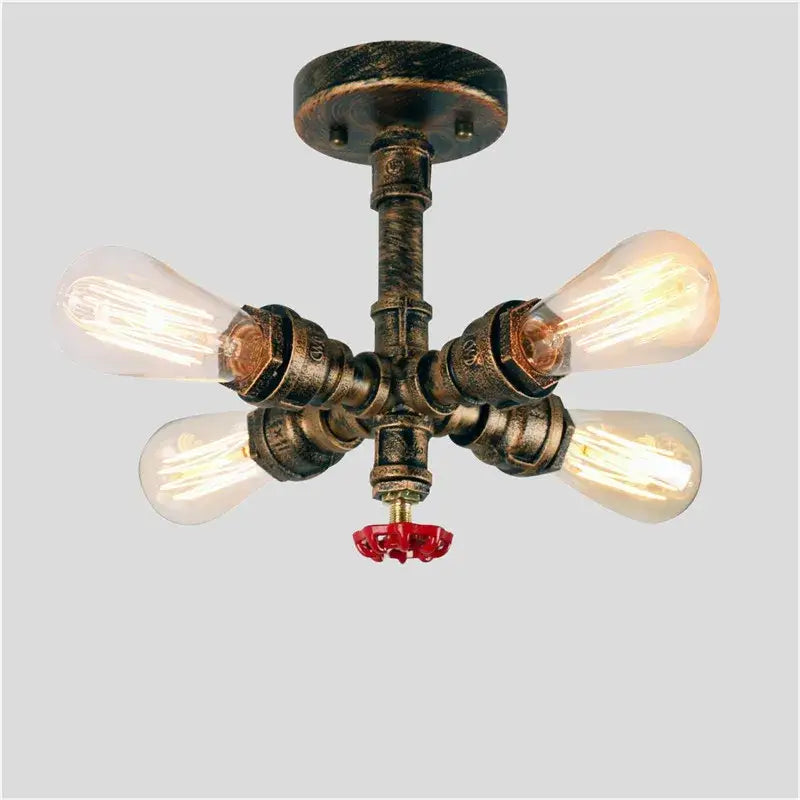 Industrial brass ceiling chandelier with four exposed edison bulbs and red valve for dining room decorbites industrial brass