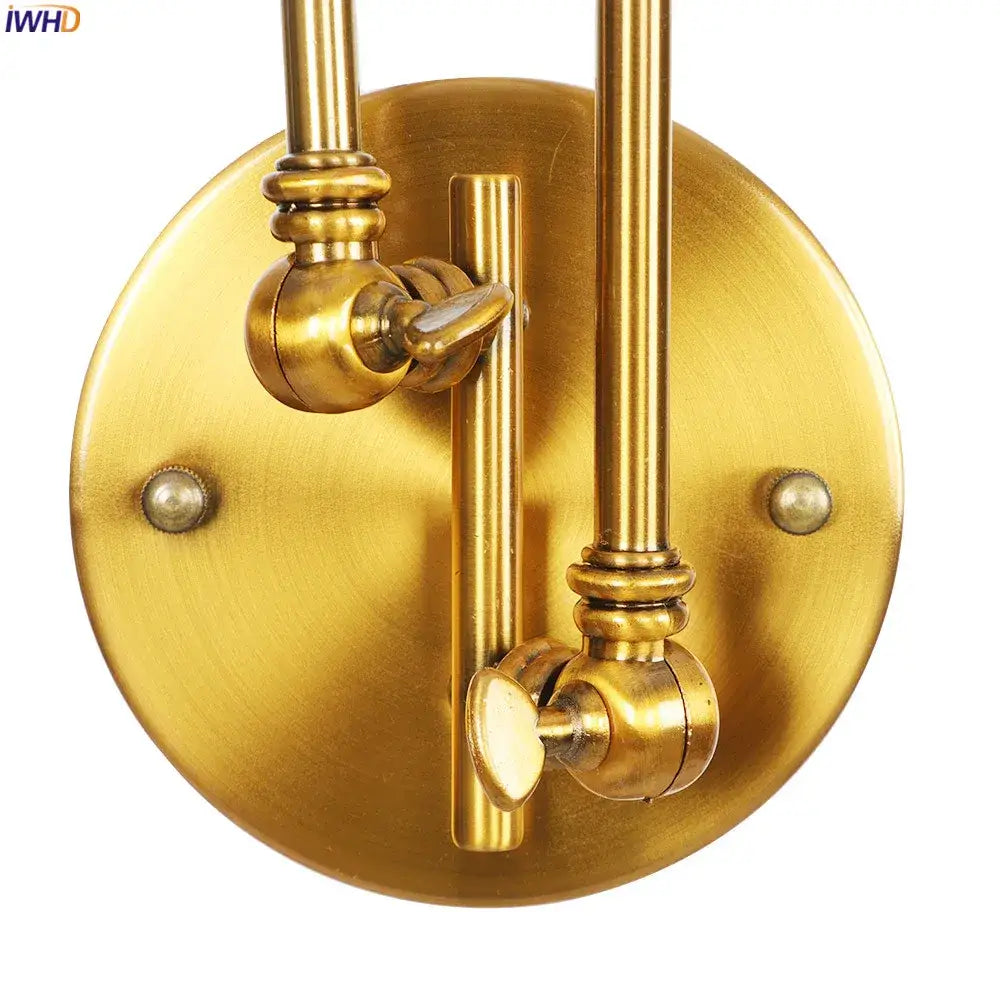 Industrial brass dual head adjustable wall sconce with ornate joints and circular backplate decorbites wall sconce