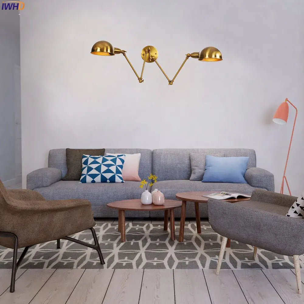 Gold-colored industrial brass wall sconce with three adjustable arms and dome-shaped lamp heads for bedroom wall lamp decorbites wall sconce