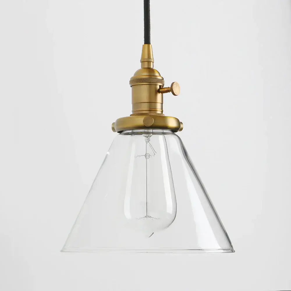 Industrial brass funnel flared glass pendant light with clear bell-shaped glass and black cord for kitchen decorbites funnel flared design