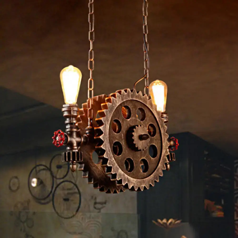 Decorbites antique gear pendant light with brass gear, red valve accents, and two exposed edison bulbs for dining room
