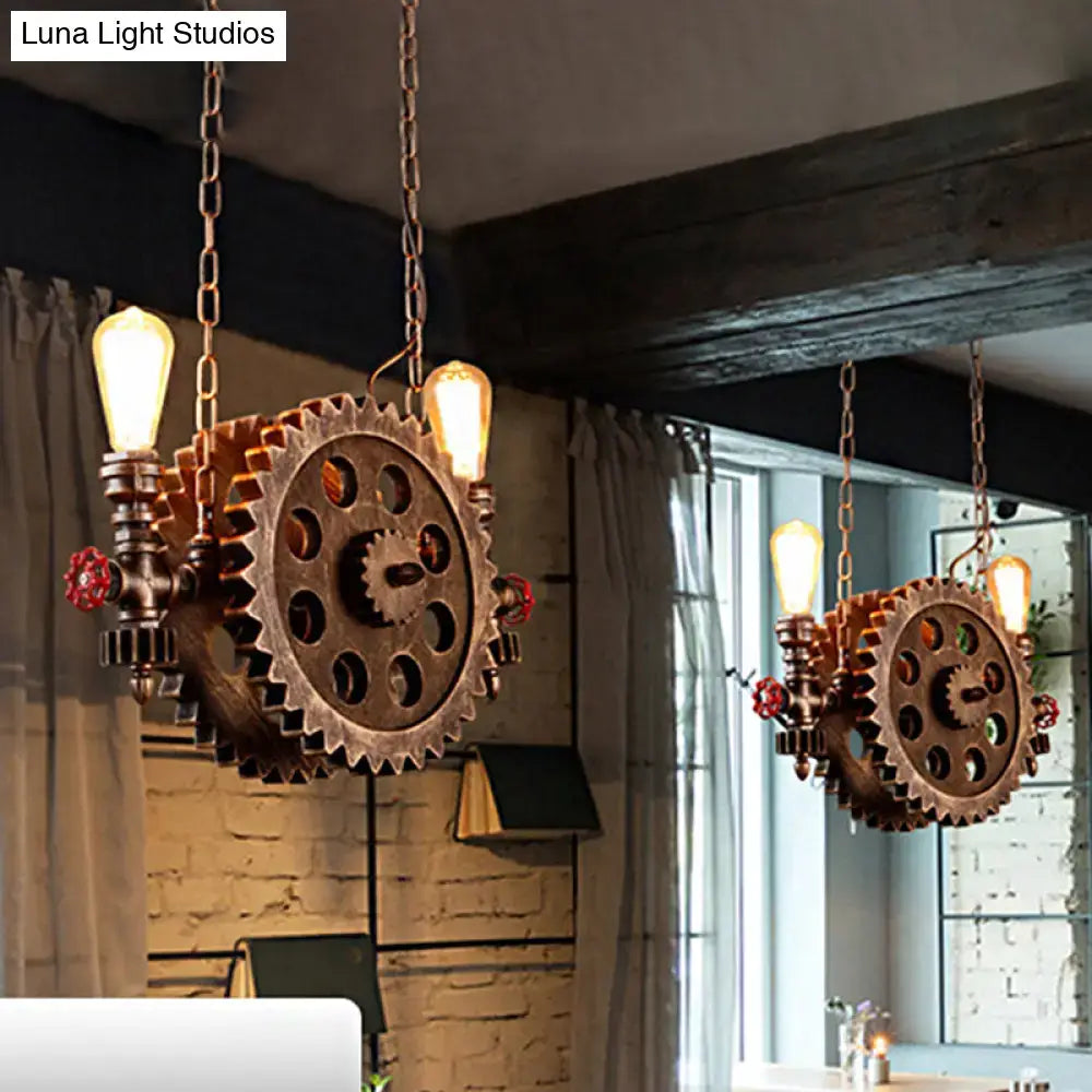 Decorbites™ antique gear pendant light with copper gears, exposed filament bulbs, and red valve accents for dining room