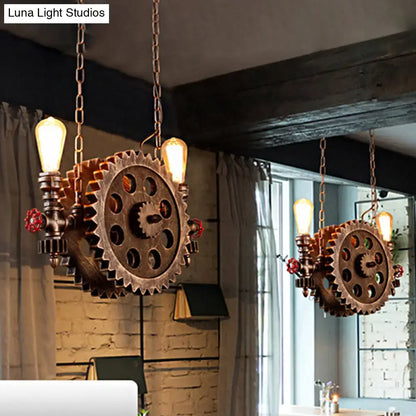 Decorbites™ antique gear pendant light with copper gears, exposed filament bulbs, and red valve accents for dining room