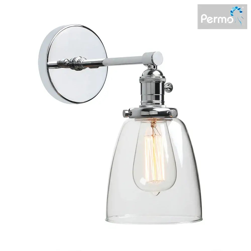 Chrome finished industrial brass wall sconce light with clear glass bell shade and exposed edison bulb for bedroom use