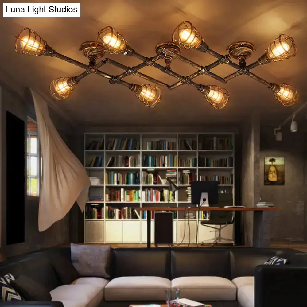Industrial brass intersecting piping ceiling light with dark metallic frame and warm amber glow for dining room cage lighting