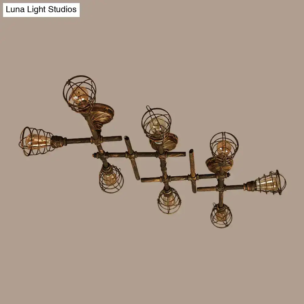 Industrial brass intersecting piping ceiling light with six exposed filament bulbs in wire cages for dining room