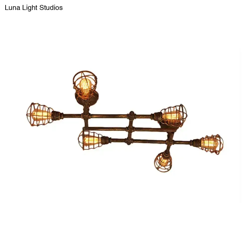 Industrial intersecting piping ceiling light with five exposed filament bulbs in dark bronze metal cage for dining room