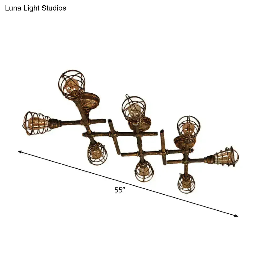Industrial brass intersecting piping ceiling light with five exposed filament bulbs in wire cages for dining room use