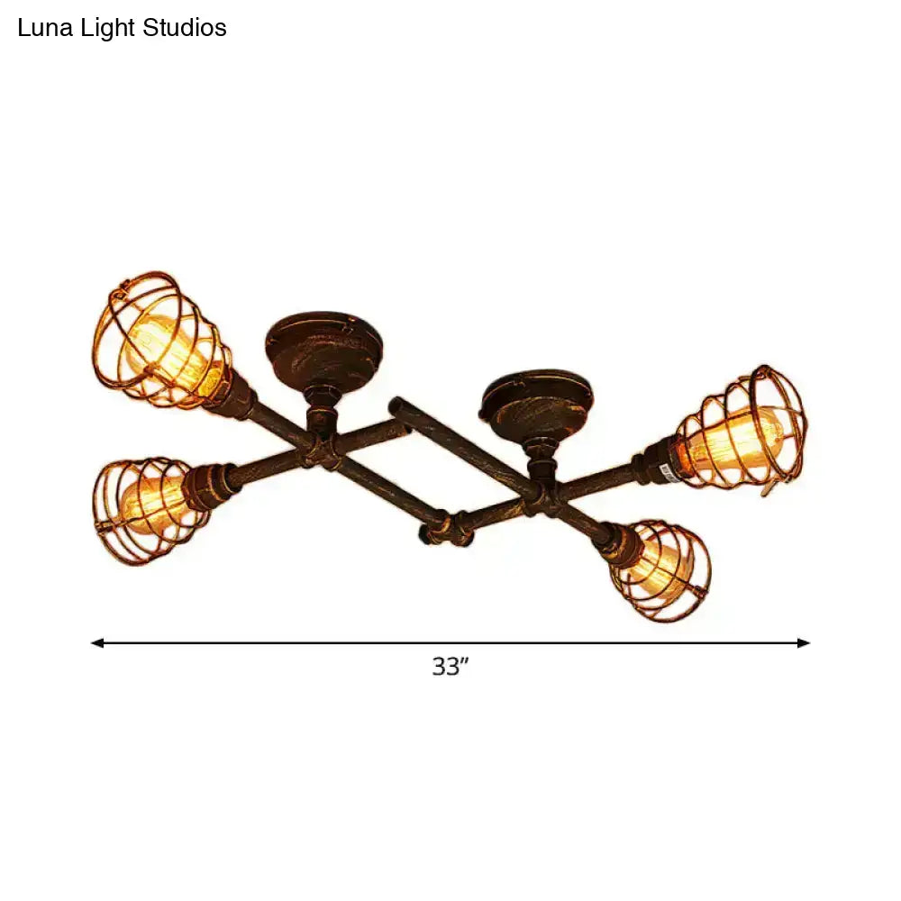 Industrial brass intersecting piping ceiling light with four exposed Edison bulbs in dark bronze wrought iron cages