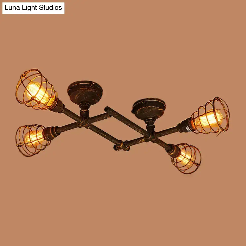 Industrial intersecting piping ceiling light with four exposed edison bulbs in dark bronze metal frame for dining room cage