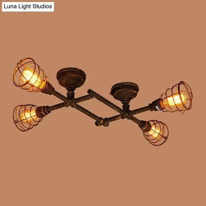 Industrial intersecting piping ceiling light with four exposed edison bulbs in dark bronze metal frame for dining room cage