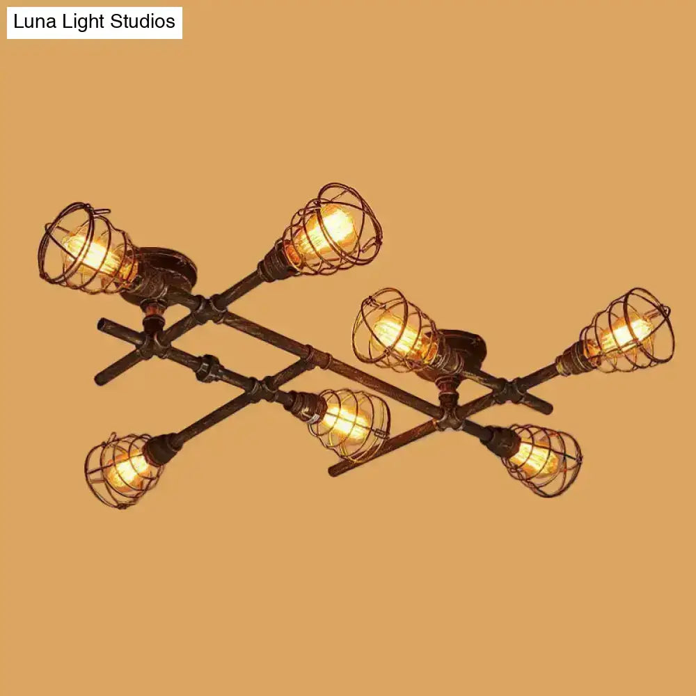 Industrial brass intersecting piping ceiling light with six warm bulbs in dark metal wire cage for dining room