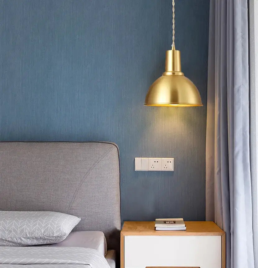 A brass industrial pendant light with a dome-shaped iron art led shade hanging from a twisted chain for kitchen decorbites decor