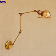 Brass-finished adjustable industrial led wall lamp with dome-shaped shade and articulated arms for bedroom reading light
