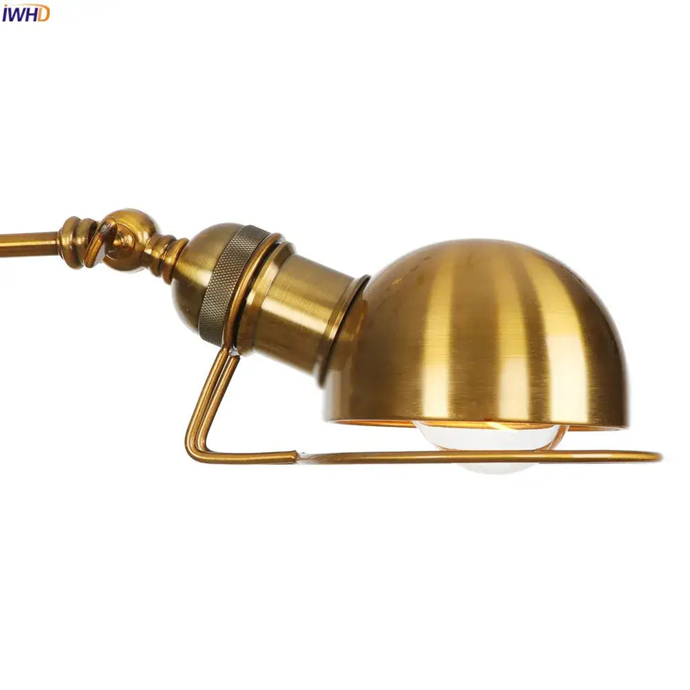 Industrial brass swing arm wall sconce featuring a brass-finished dome shade with vertical ridges and adjustable arm for reading