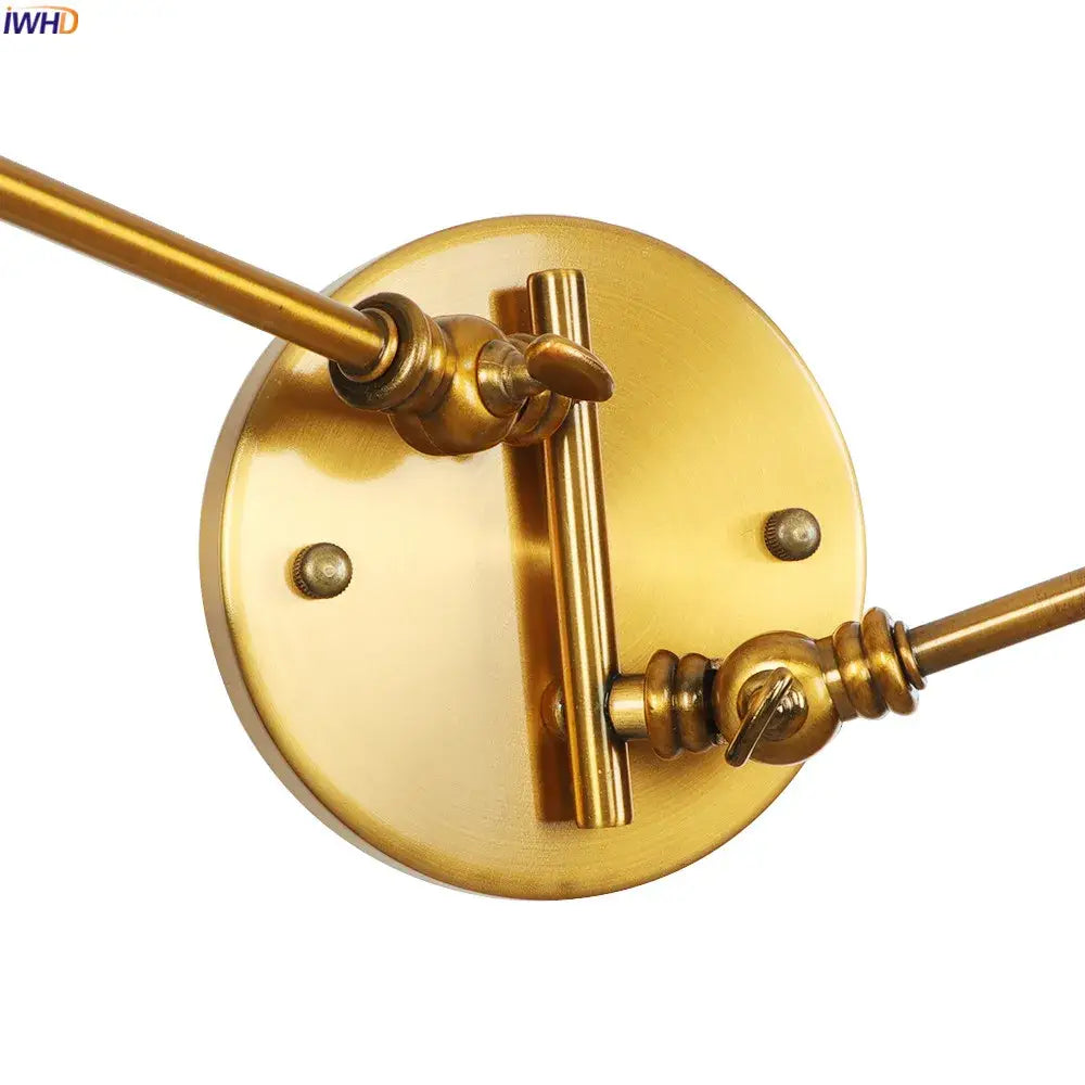 Brass-finished industrial swing arm wall sconce with circular base and two extendable arms for bedroom reading decorbites industrial swing