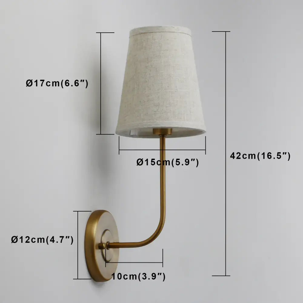 Industrial brass wall lamp set with brass finish and tapered off-white linen shades for bedroom reading light