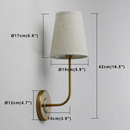 Industrial brass wall lamp set with brass finish and tapered off-white linen shades for bedroom reading light