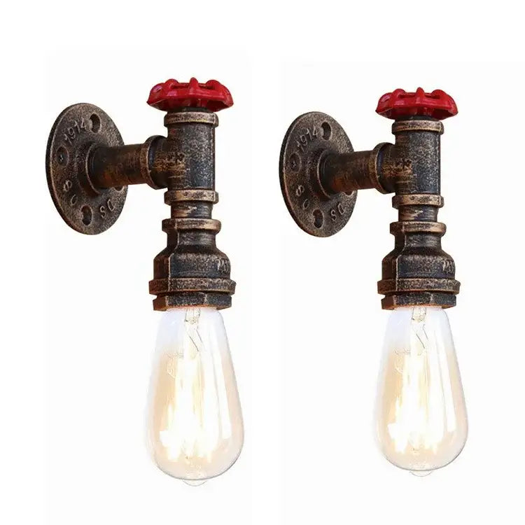 Industrial bronze and black wall lamp with rusted metal pipes and red valve handles featuring clear filament bulbs
