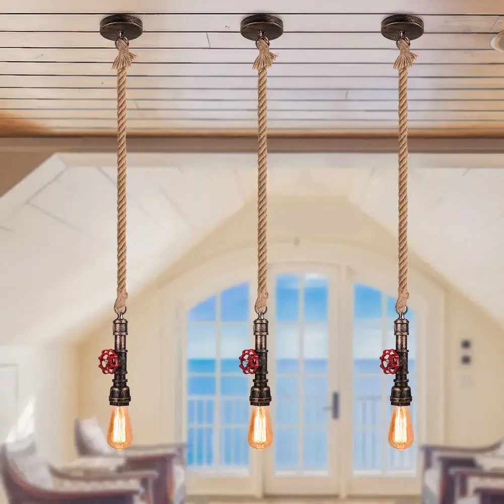 Three industrial bronze iron water pipe pendant lights with rustic rope suspension and red valve accents for kitchen use