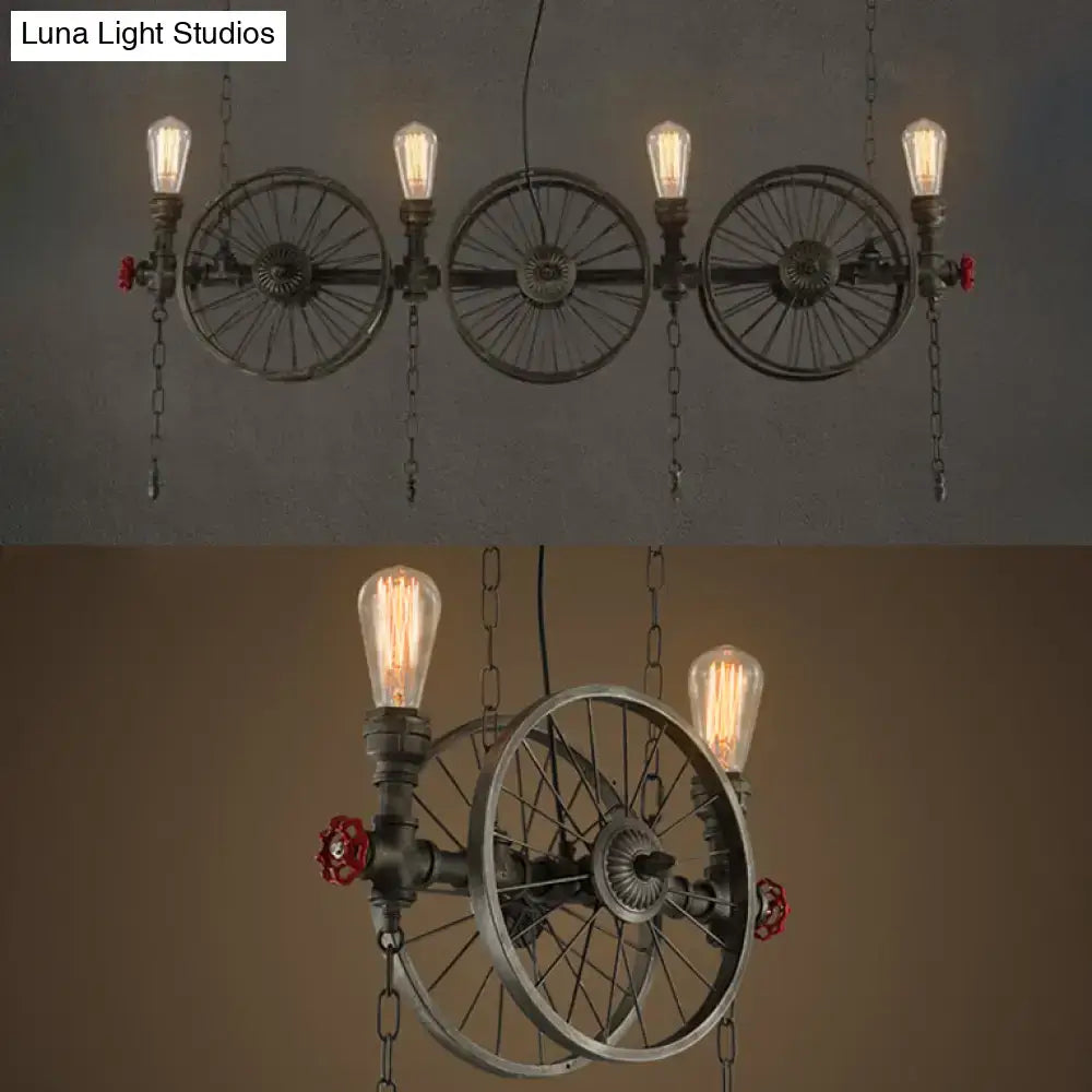Industrial-style island light featuring bronze metal pipe frame with three vintage wheel design and exposed led incandescent bulbs