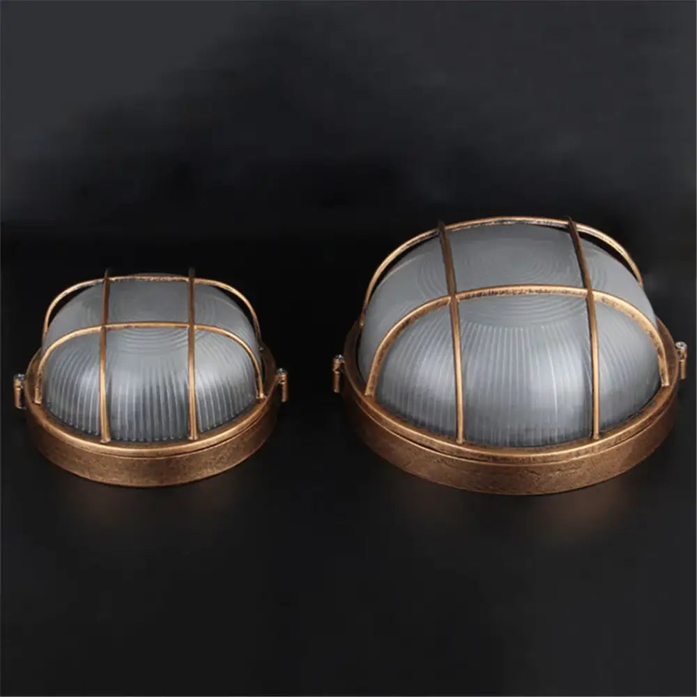 Vintage-style industrial bronze outdoor ceiling lamp with frosted glass domes and brass metal cage design
