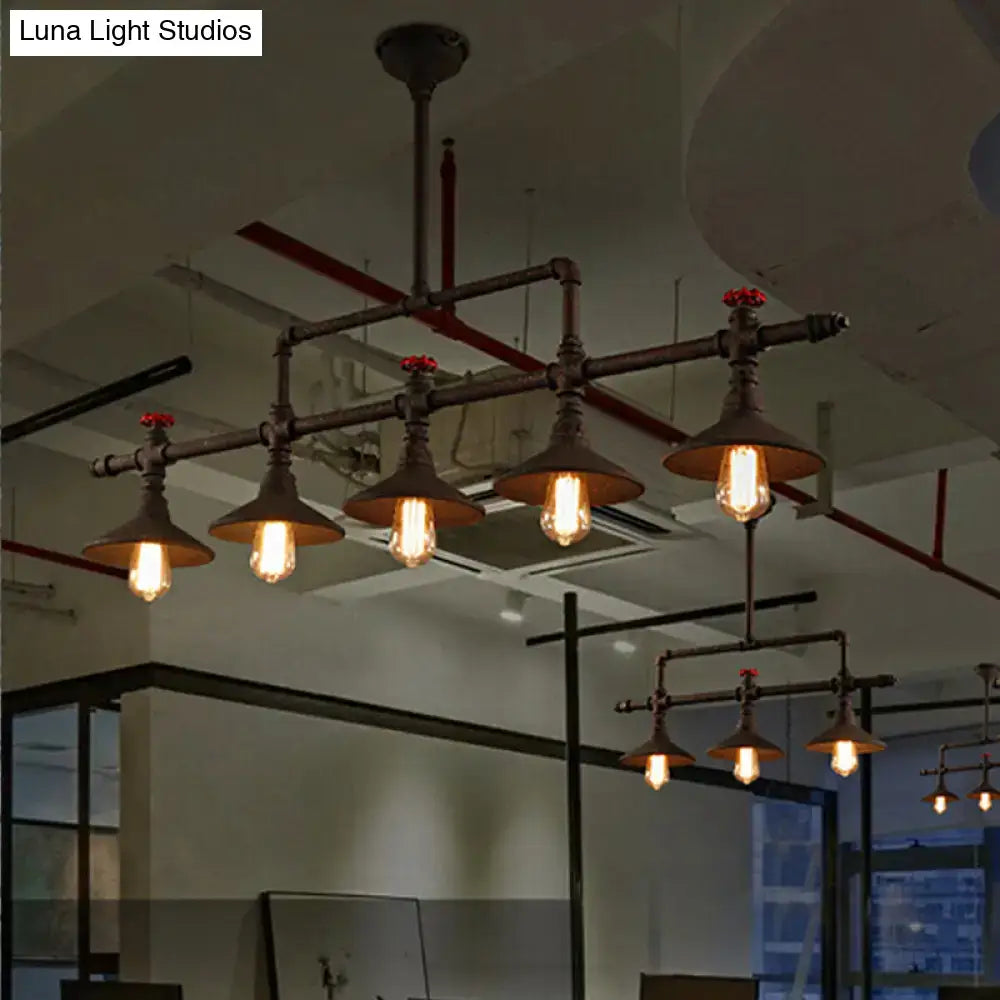 Industrial bronze pipe island light with dark metal pipes and vintage edison bulbs for dining room use