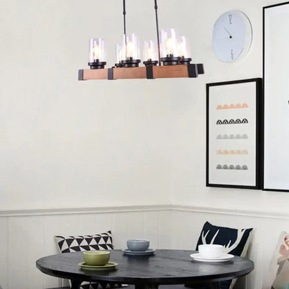 A modern farmhouse-style decorbites™ industrial brown island lighting with clear glass cylinder shades for dining rooms