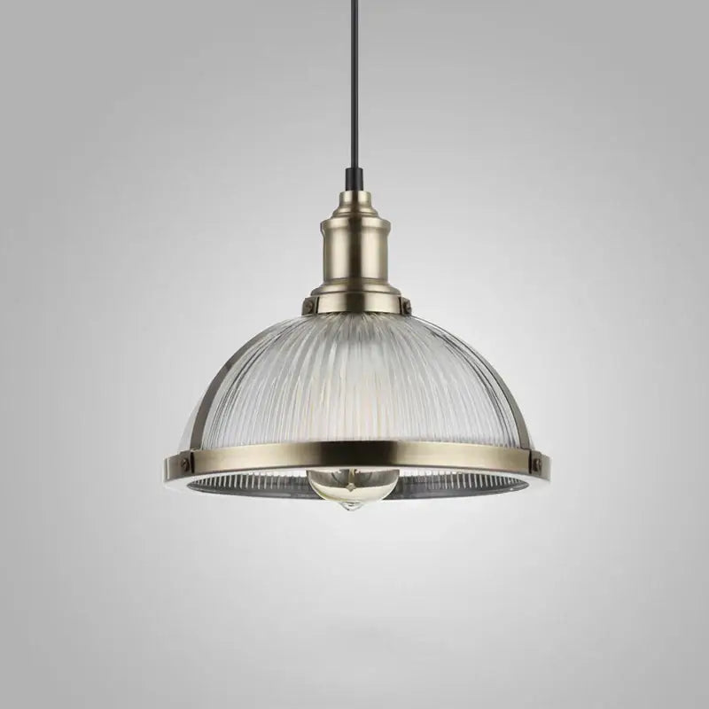 Industrial brushed nickel pendant light with brass metal frame and clear ribbed glass shade for dining room use