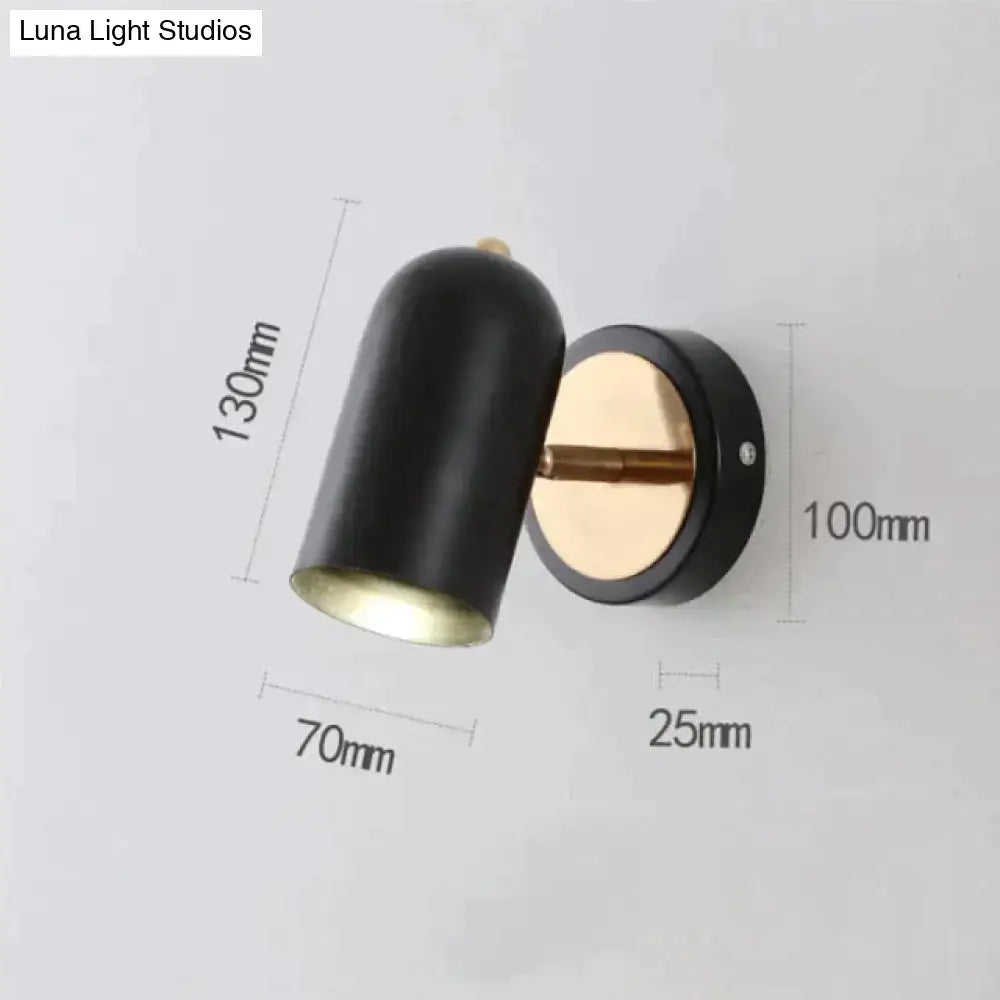 Industrial brushed nickel led wall sconce with black cylindrical shade and brass circular base for bedroom spotlight