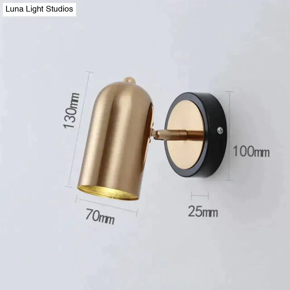 Gold-toned industrial led wall sconce with sleek finish, black base, adjustable arm, ideal for bedroom spotlight use