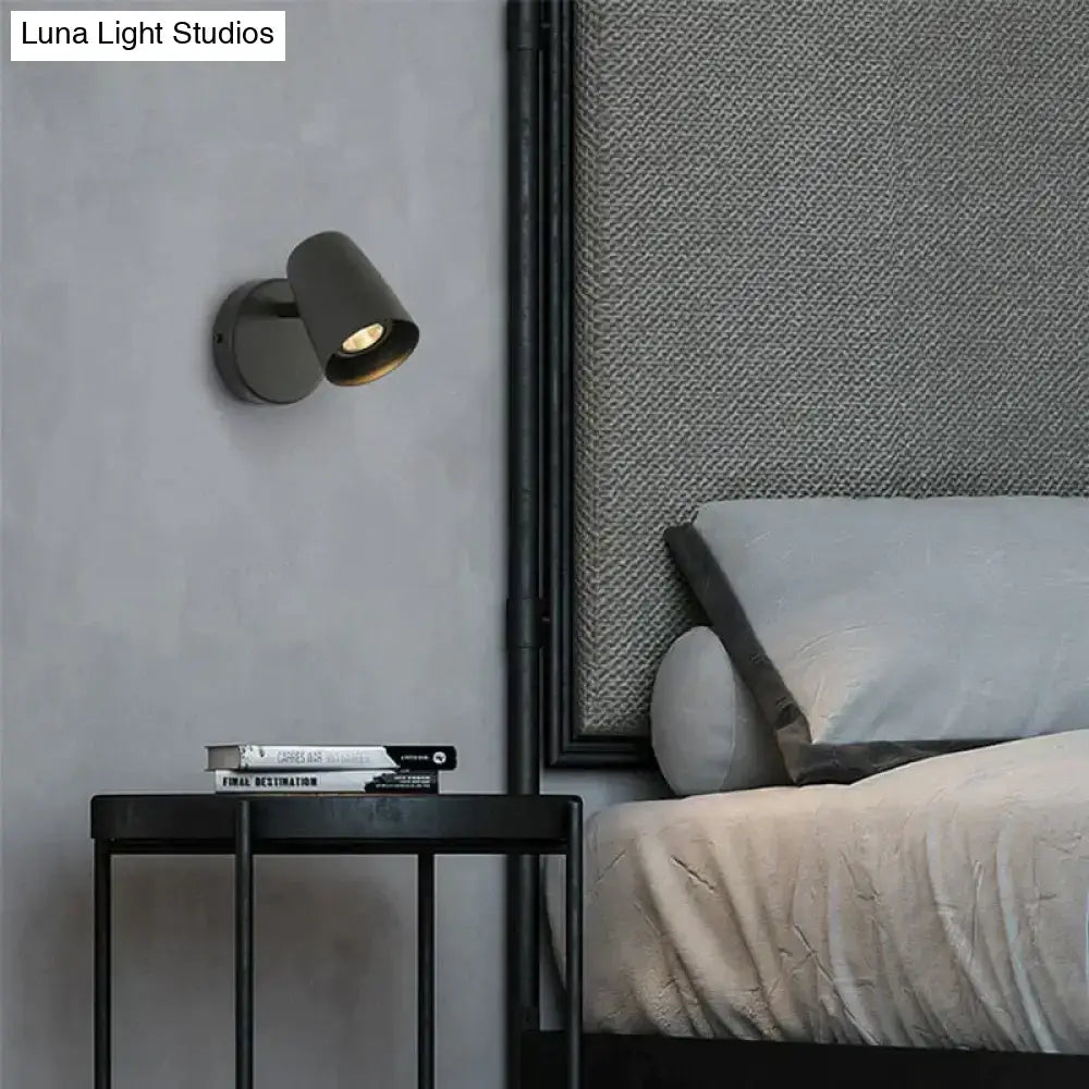 Modern matte black industrial led wall sconce with cylindrical adjustable head for bedroom lighting