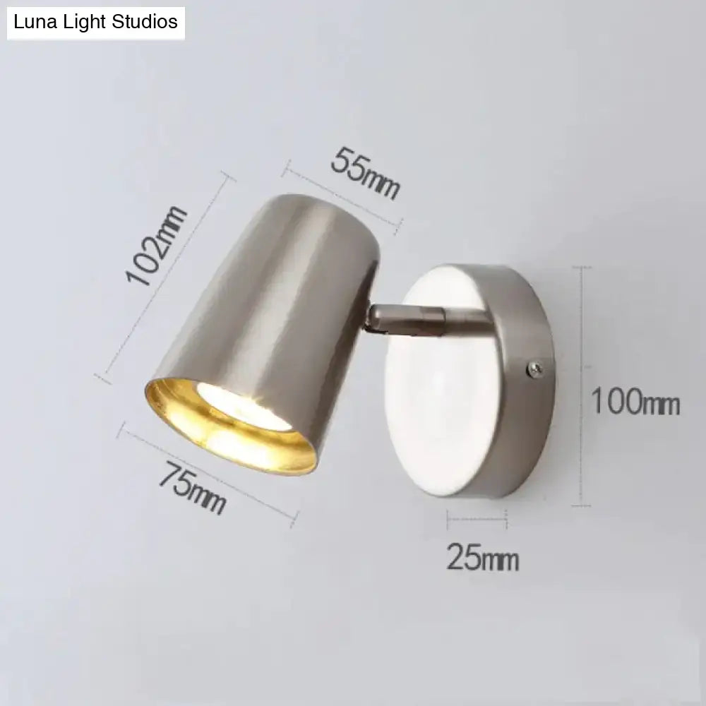 Industrial brushed nickel led wall sconce with modern brushed stainless steel spotlight and gold-toned interior