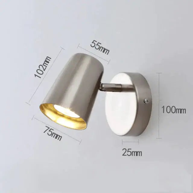 Modern industrial led wall spotlight in brushed nickel with adjustable arm and cylindrical head for bedroom use
