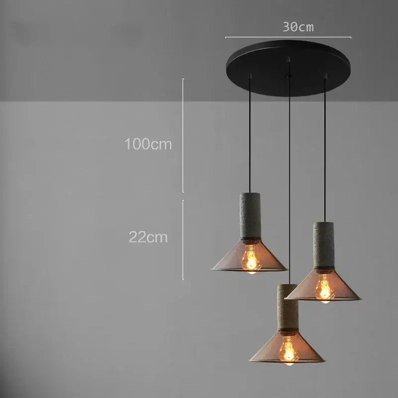 Industrial cement metal pendant light with three concrete-textured shades and amber-tinted glass for dining room decorbites industrial cement