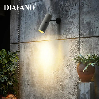 Diafano industrial cement wall lamp with matte gray cylindrical design and warm yellow light for living room decorbites industrial cement